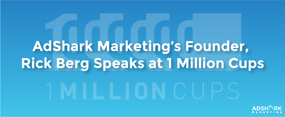 A blue image box with the text caption, 'AdShark Marketing's Founder, Rick Berg, Speaks at 1 Million Cups.'
