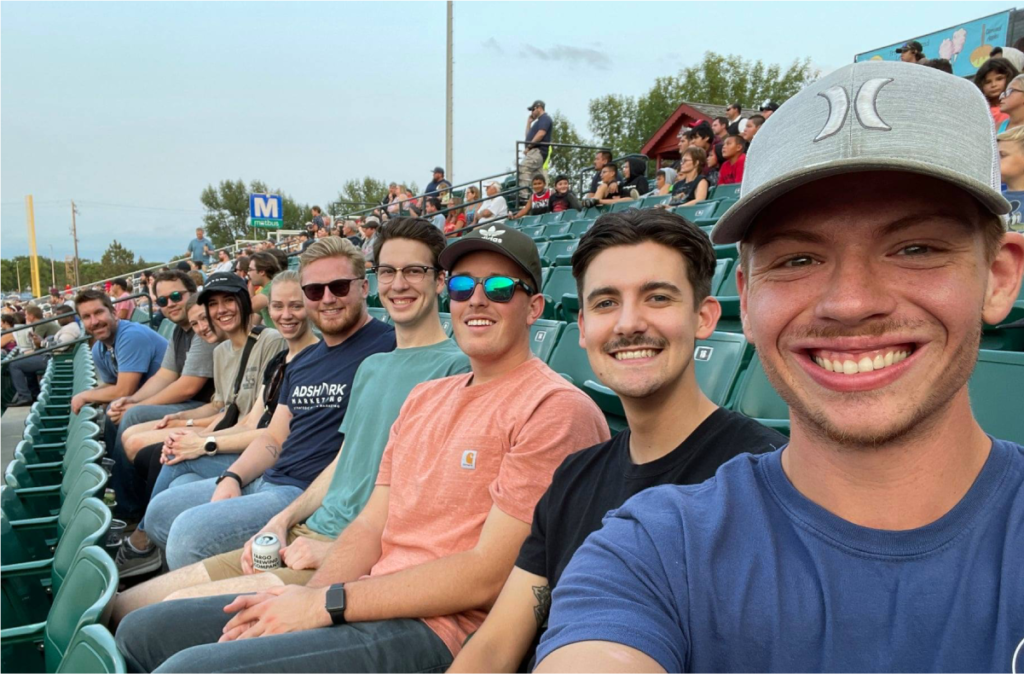 Selfie of the AdShark team enjoying a RedHawks baseball game.