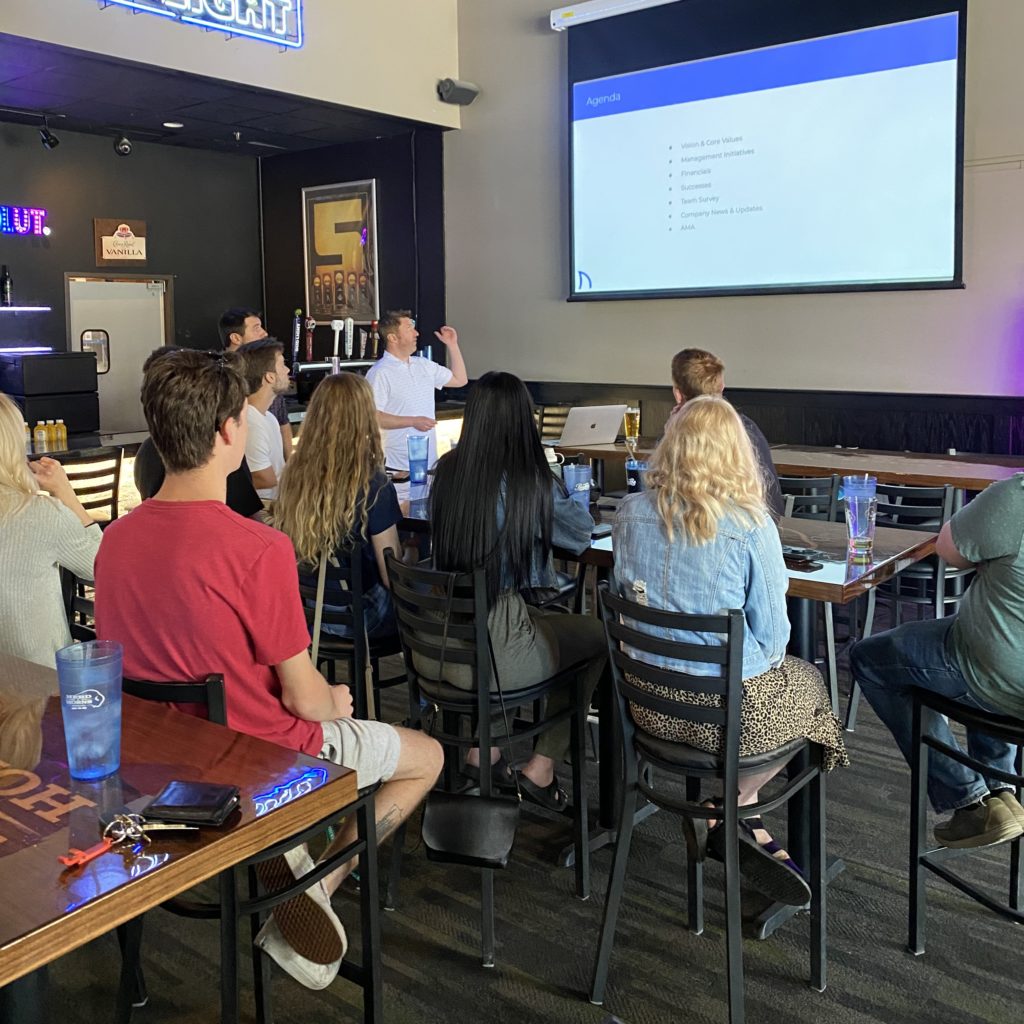 Image of AdShark Marketing employees gathering at Herds and Horns in Fargo, North Dakota for a company-wide meeting.