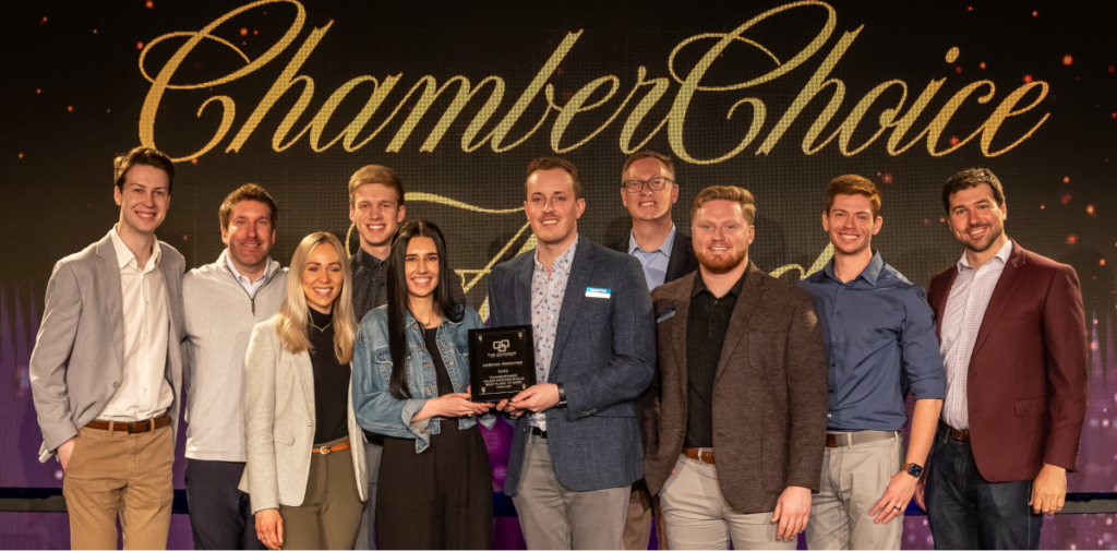 The AdShark team accepts the award as a finalist for the "Young Professionals Best Place to Work" Award. From left to right: Nick Loock, Rick Berg, Whitney Jensen, Evan Engler, Sam Carver, Jack Yakowicz, Chris Jensen, Justin Monroe, Nick Due, Sean Maki.